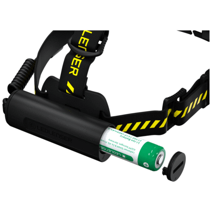 Rear view showing battery compartment and charging port with inserted rechargeable battery.