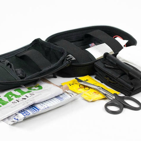 Operator IFAK laid flat showing fully stocked kit: gloves, trauma dressings, shears, and more. Designed for critical field interventions. TacMed Australia – trusted by military, police, and remote responders.