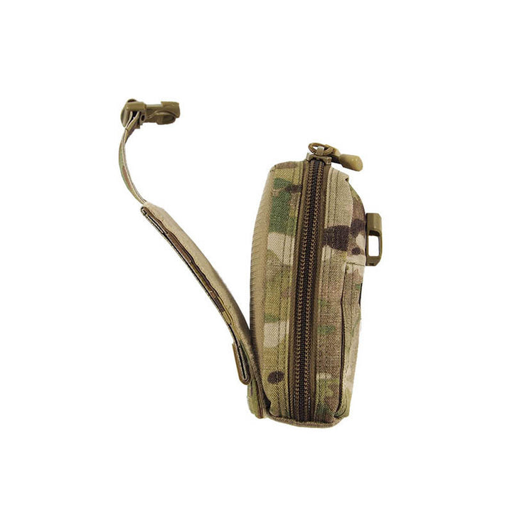 IFAK pouch open with contents exposed, showing internal compartments and zipper partially undone.