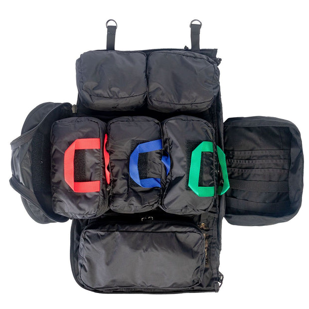 NAR Multi Mission Trauma Pack in black, a rugged backpack with 3200 cubic inch capacity for tactical medics. Features six detachable compartments, internal MOLLE with hook-and-loop, a multi-mission belt, and rappelling loops. Converts into a trauma sheet for vehicle or aircraft use. Includes North American Rescue branding. Bag only, gear sold separately