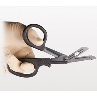 NAR Trauma Shears being held by gloved hand, demonstrating ergonomic grip and cutting position. Built for durability and safe patient care. TacMed Australia – essential trauma tool for first responders and tactical kits.