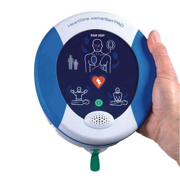 Defibrillator held in hand to show compact size and ergonomic design.