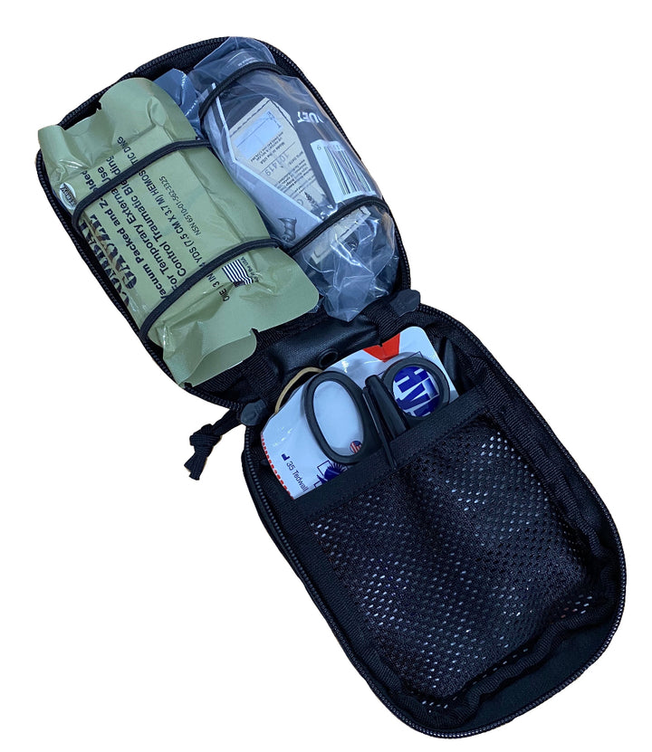 TT Tactical IFAK opened to show packed medical supplies including gauze, tourniquet, and trauma shears.