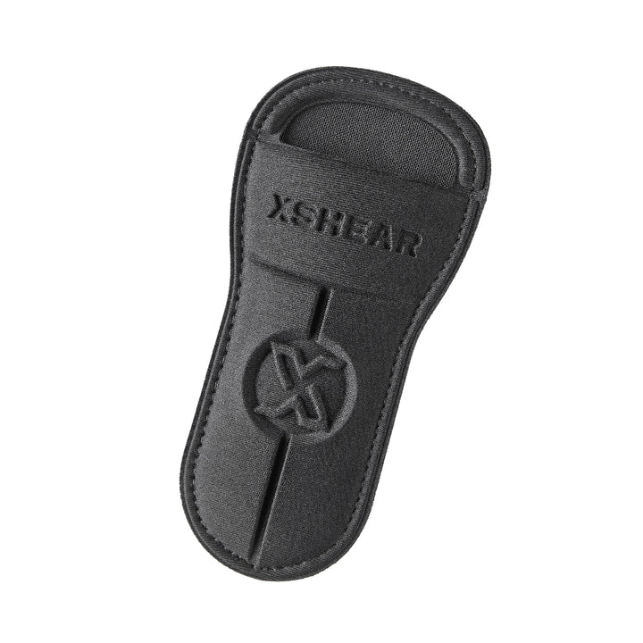 Black XShear Soft Holster with stitched logo and belt loop slot, designed to hold trauma shears securely.